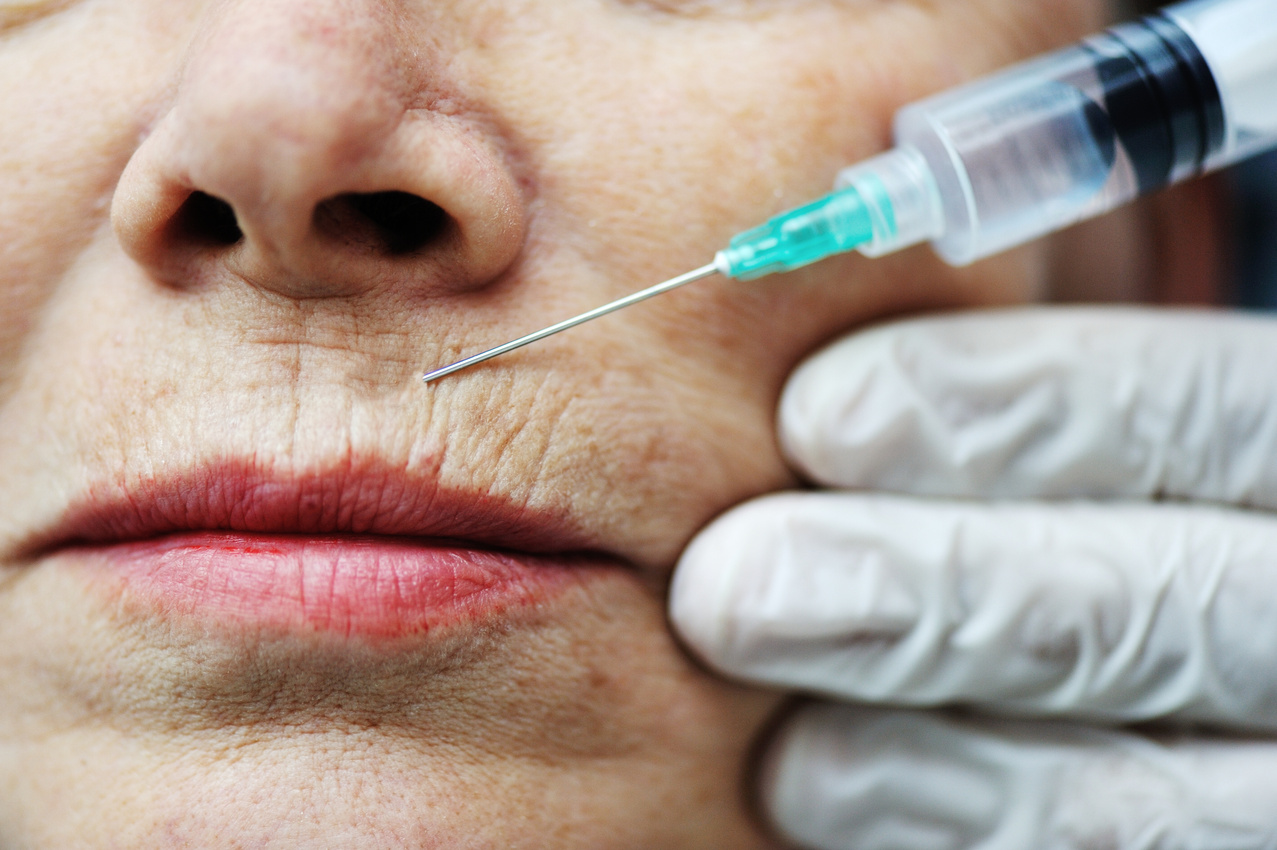 Elderly Woman Getting Botox Injection Procedure