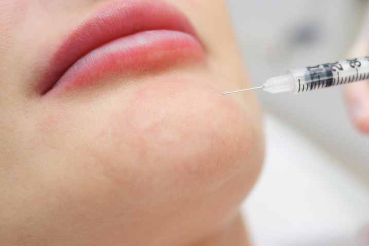 clinic specialist injects hyaluronic acid gel on